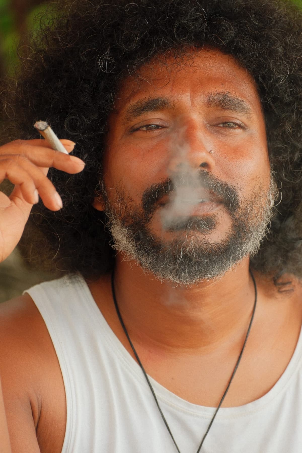 Smoke and stillness, a portrait between waves