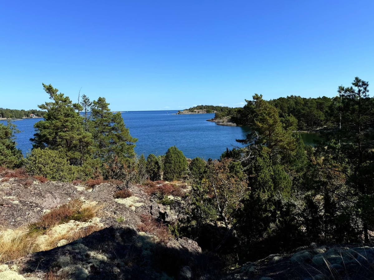 Bare granite headland, the islands scattered out to sea